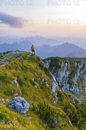 Hikers at the summit of the Benediktenwand at sunset