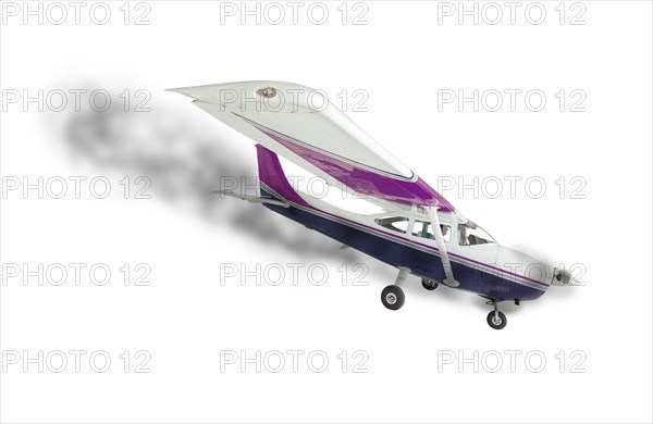 The cessna 172 with smoke coming from engine on a white background