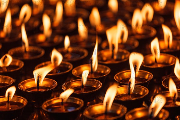 Burning candles in Buddhist temple. Dharamsala