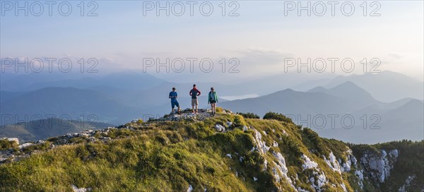 Three hikers at the summit