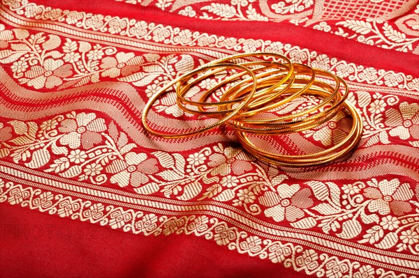 Indian sari with golden bangles clouse up