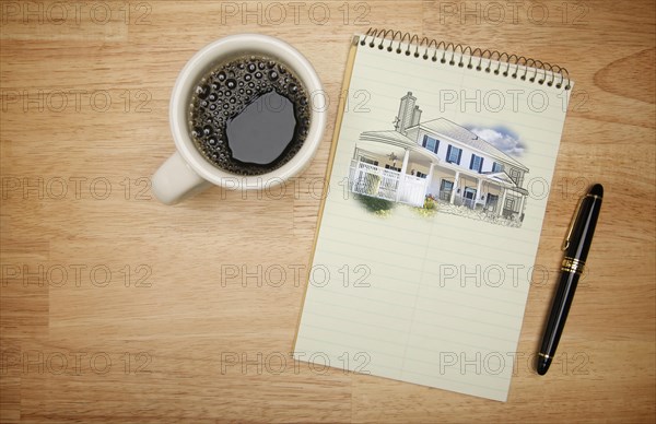 Pad of paper with house drawing