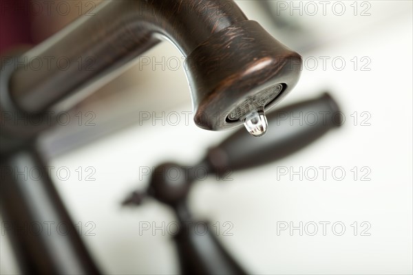 Close-up of water dripping from water faucet