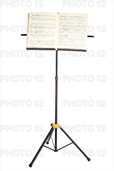 Music stand with piano notes isolated on white