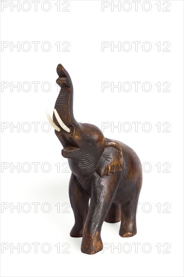 Wooden elephant figurine from Thailand isolated on white background