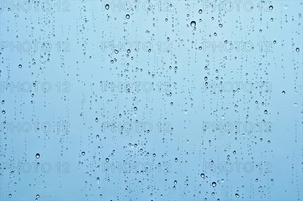 Rain water drops droplets on window glass texture background