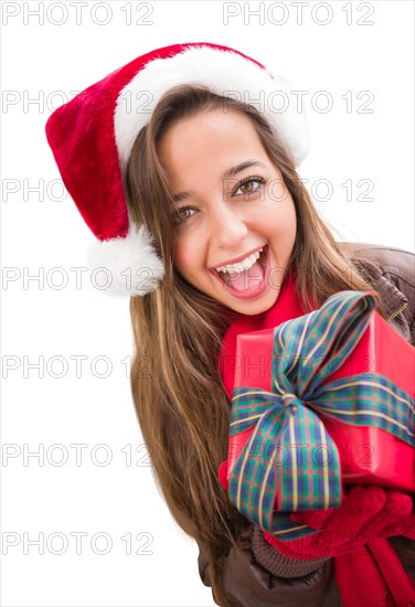 Girl wearing A christmas santa hat with bow wrapped gift iisolated on white