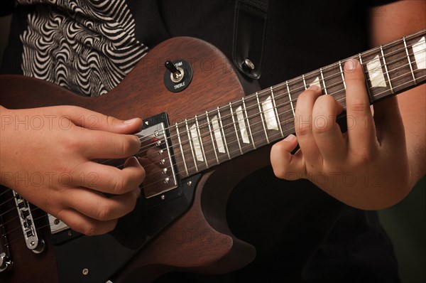 Musician plays his gibson les paul studio electric guitar