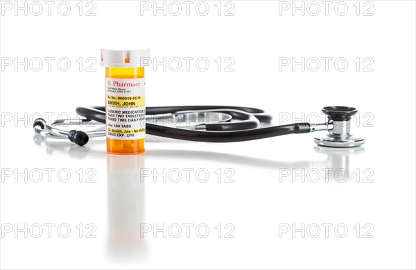 One non-proprietary medicine prescription bottle with stethoscope isolated on a white background
