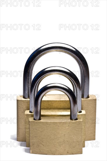 Three padlocks of different size isolated on white