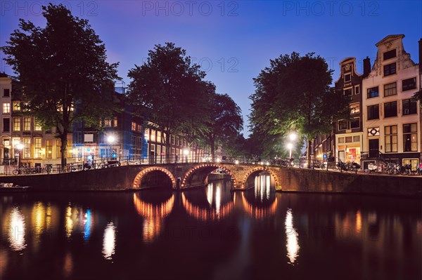 Night view of Amterdam cityscape with canal