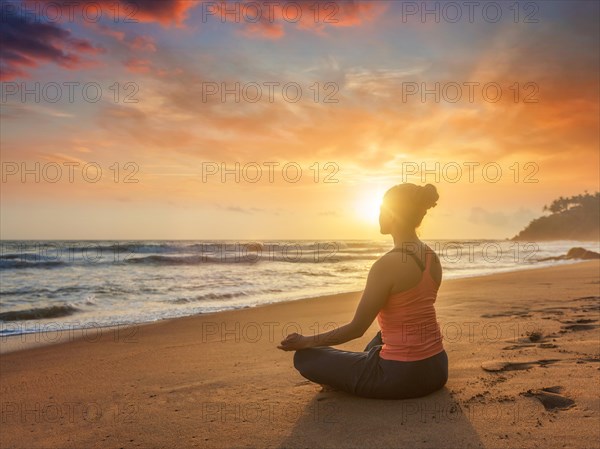 Young sporty fit woman doing yoga