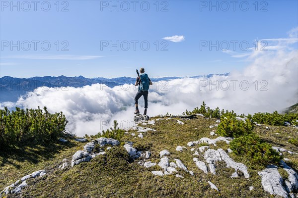 Hiker above the clouds