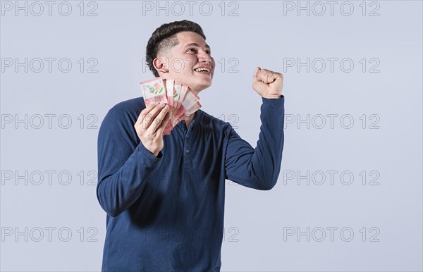 Excited man with money in his hand