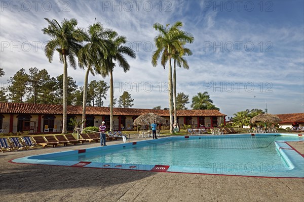 Man cleaning swimming pool