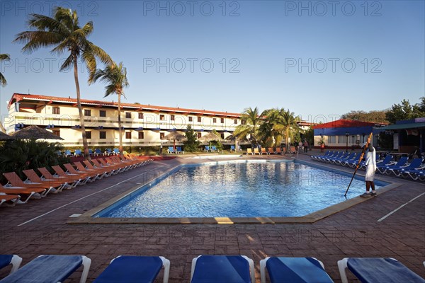 Man cleaning swimming pool