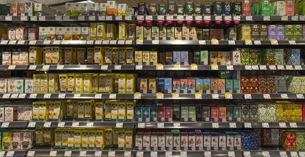 Shelves with different types of tea bags in an organic supermarket