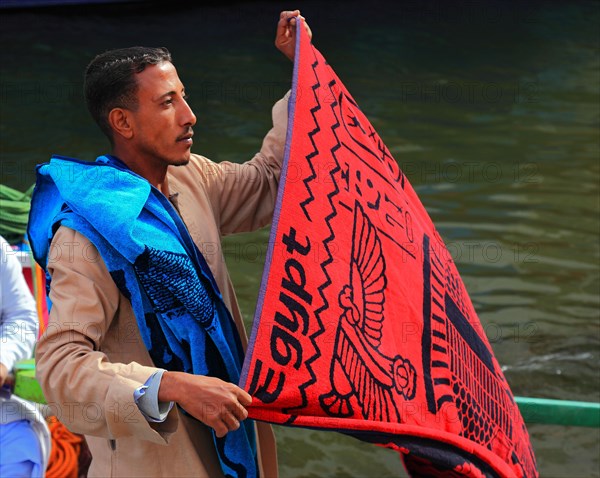 Souvenir seller with a rowing boat on the Nile
