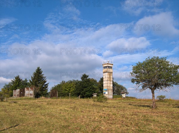 Old border tower and border installations in the High Rhoen on the Bavarian-Thuringian border near the core zone of the Rhoen Biosphere Reserve Berghoehe Schwarzes Moor