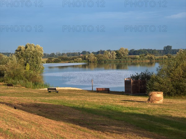 Meadow and bathing beach at Gartow Lake in the Elbe River Landscape UNESCO Biosphere Reserve. Gartow