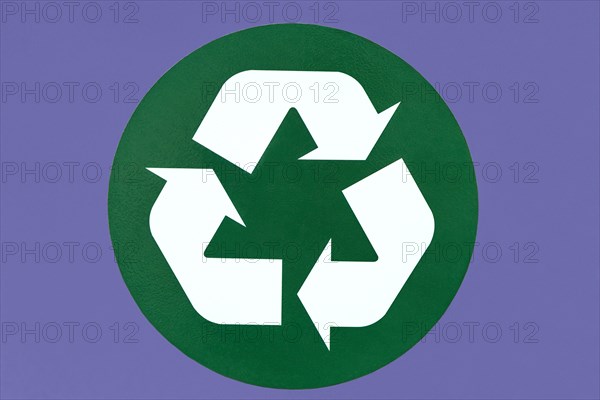 Recycle symbol on a purple background