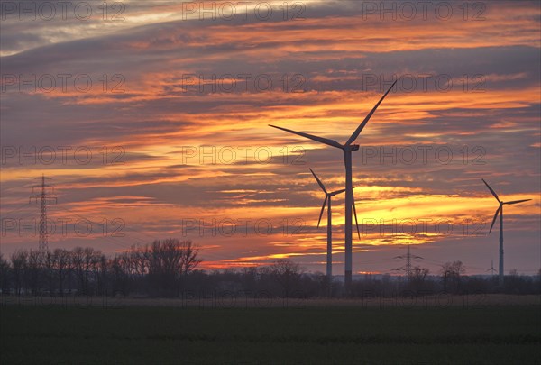 Wind turbines and power line in the evening. Wind turbines in the Hamburg Vier- und Marschlanden