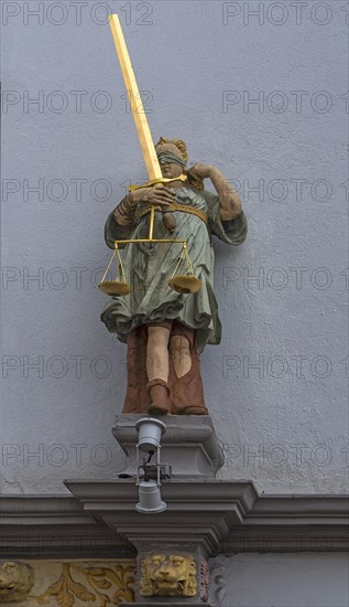 Renaissance figure of Justitia from 1568 above an entrance portal