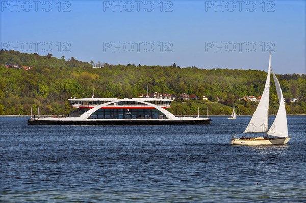 Car ferry Lodi and sailing boat