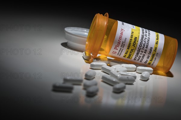 Hydrocodone pills and prescription bottle with non proprietary label. no model release required