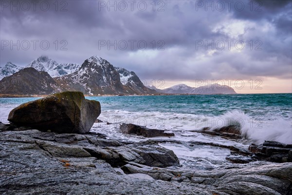 Rocky coast of fjord of Norwegian sea in winter. Vareid