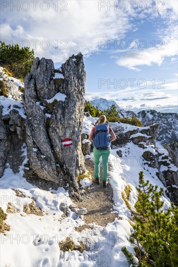 Young female hiker on hiking trail to Kramerspitz