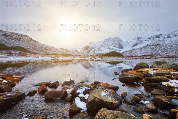 Sunset in Norwegian fjord in winter. Lofoten islands