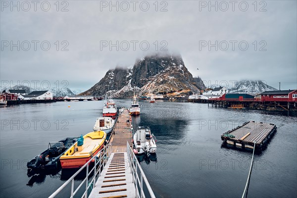 Pier with ships in Hamnoy fishing village on Lofoten Islands