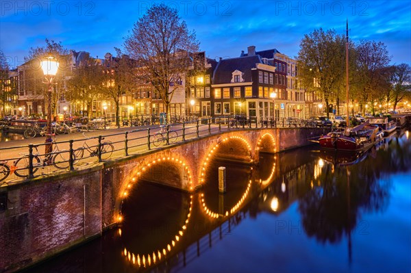 Night view of Amterdam cityscape with canal