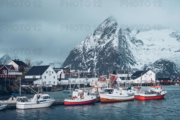 Pier with ships in Hamnoy fishing village on Lofoten Islands