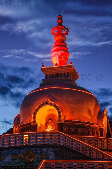 Shanti stupa illuminated in the evening twilight. Leh