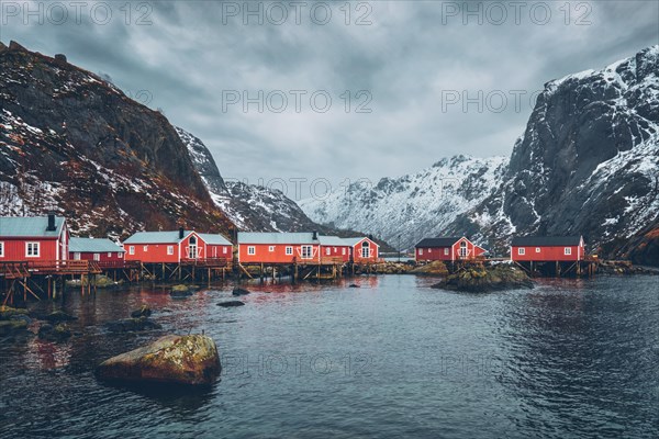 Nusfjord authentic fishing village with traditional red rorbu houses in winter. Lofoten islands