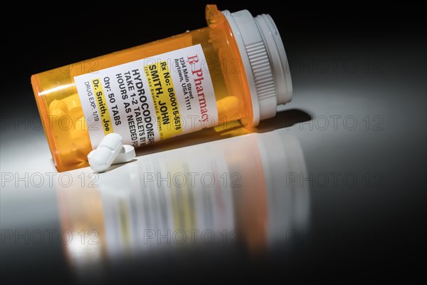 Hydrocodone pills and prescription bottle with non proprietary label. no model release required