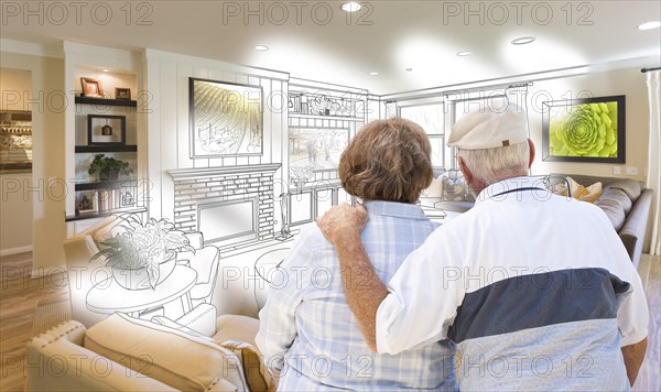 Curious senior couple looking over custom living room design drawing photo combination