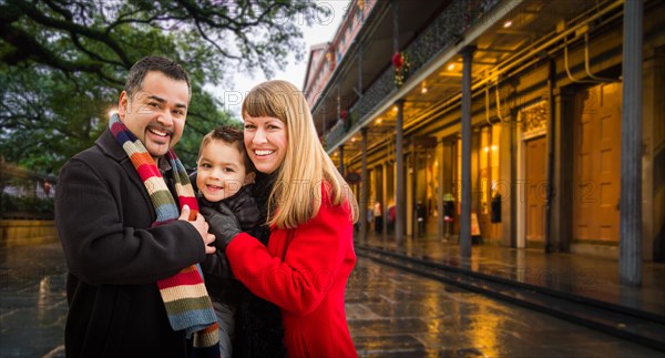 Happy young mixed-race family enjoying an evening in new orleans