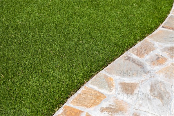 New artificial grass installed near walkway