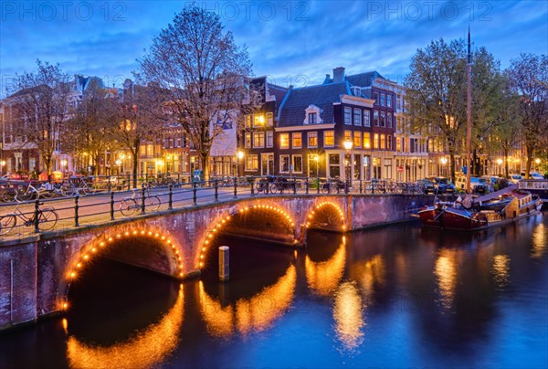 Night view of Amterdam cityscape with canal