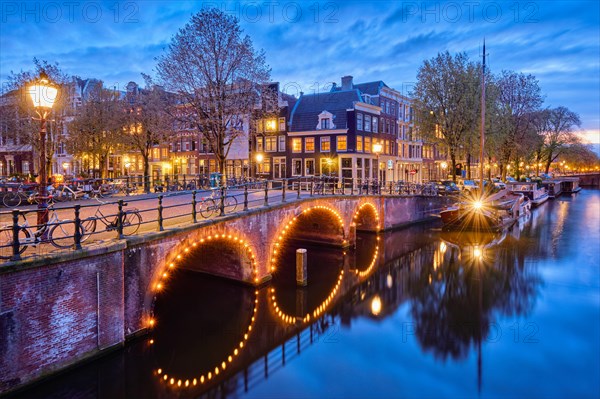 Night view of Amterdam cityscape with canal