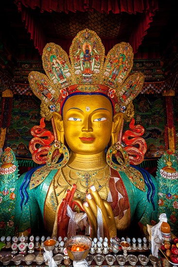 Maitreya Buddha statue face close up in Thiksey Gompa. Ladakh