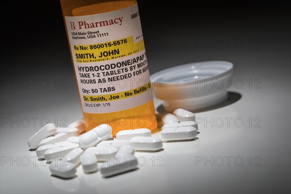 Hydrocodone pills and prescription bottle with non proprietary label. no model release required