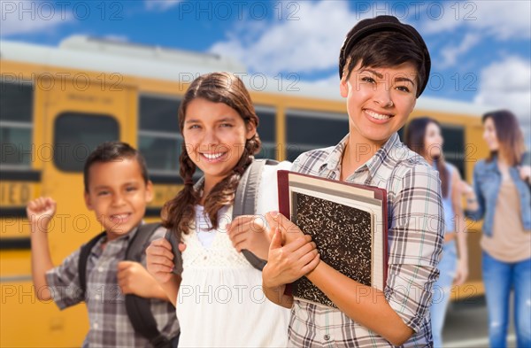 Young students walking near school bus