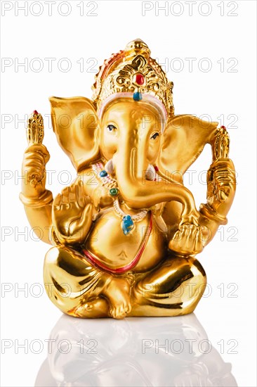 Ganesha statue isolated on white background with reflection