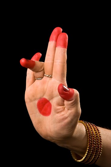 Woman hand showing Tripataka hasta