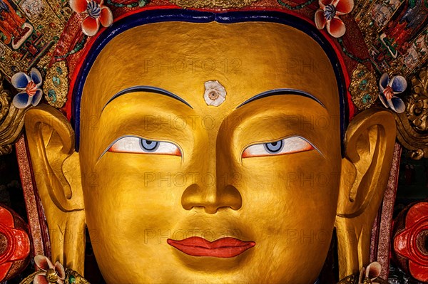 Maitreya Buddha statue face close up in Thiksey Gompa. Ladakh