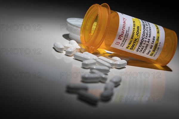 Hydrocodone pills and prescription bottle with non proprietary label. no model release required